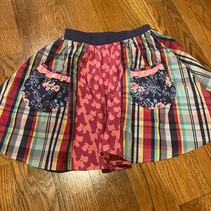 Wildflowers Multicolor Plaid and Floral Kids Skirt. Twins have 2 available